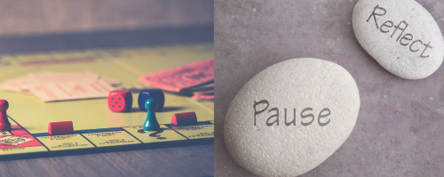 board game and stones that say pause and reflect